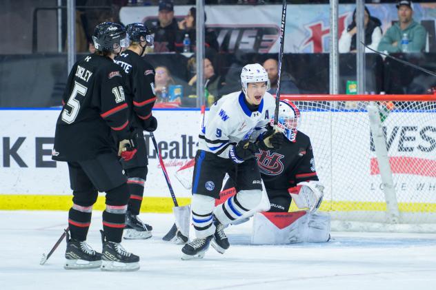 Wenatchee Wild's Aiden Grossklaus and Lethbridge Hurricanes' Kayden Longley, Grady Pichette, and Leif Oaten on game night