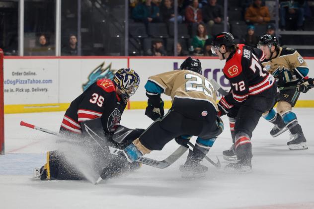 Rapid City Rush's Nathan Torchia and Étienne Morin battle Tahoe Knight Monsters' Casey Bailey