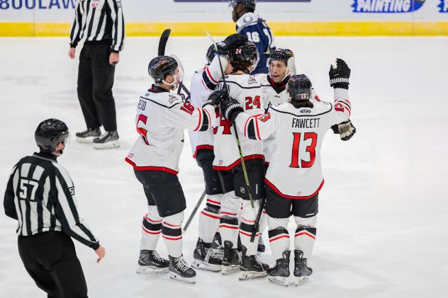 Adirondack Thunder exchange congratulations following a goal