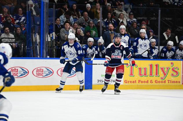 Syracuse Crunch Conor Geekie and Hartford Wolf Pack's Casey Fitzgerald on the ice