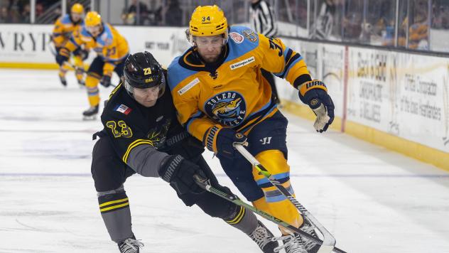 Toledo Walleye forward Jordan Ernst (right)