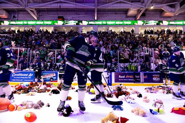 Florida Everblades collect the proceeds from the Teddy Bear Toss