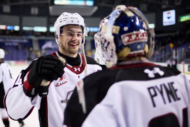 Vancouver Giants exchange congratulations after a win
