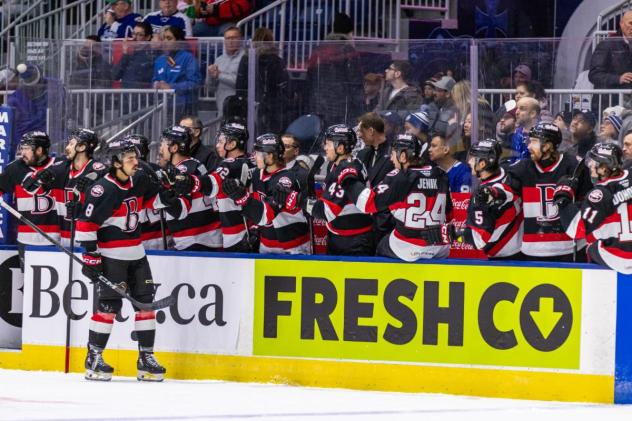 Belleville Senators congratulate Mark Duarte along the bench