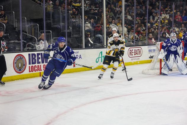 Syracuse Crunch defenseman Matteo Pietroniro (left)