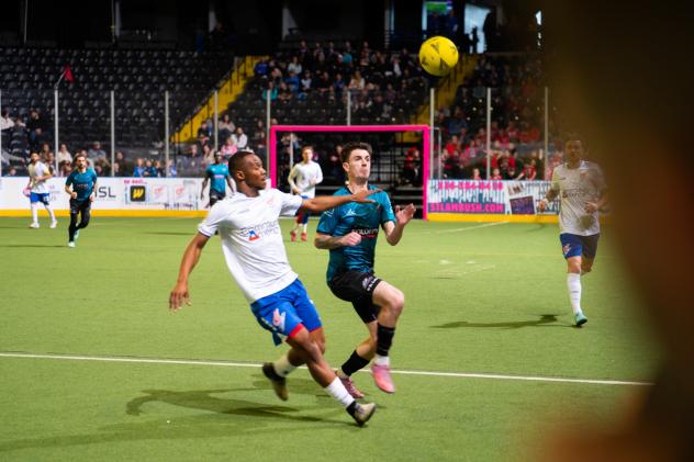 St. Louis Ambush vies for the ball against the Kansas City Comets