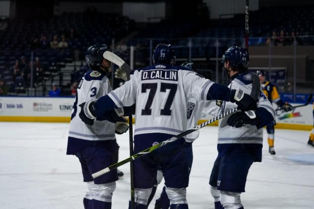 Worcester Railers react following a goal