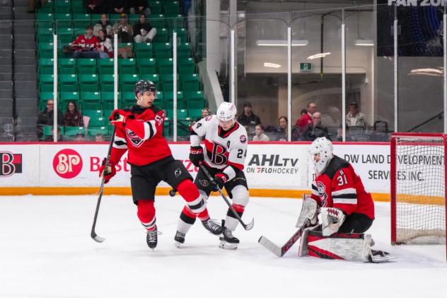 Belleville Senators centre Jan Jeník (center) vs. the Utica Comets