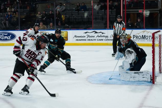 Rapid City Rush forward Ryan Wagner (left) looks for a shot against the Tahoe Knight Monsters