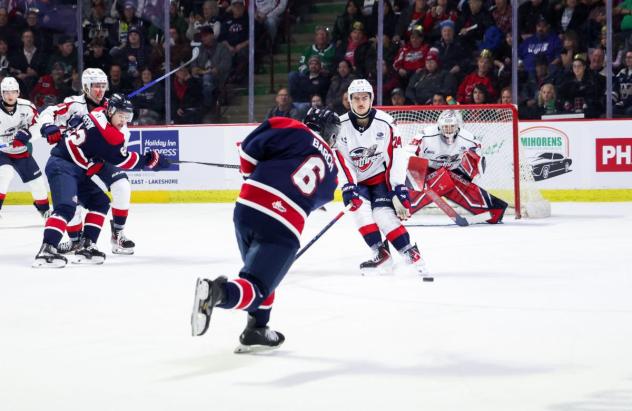 Saginaw Spirit defenseman Hayden Barch fires a shot against the Windsor Spitfires