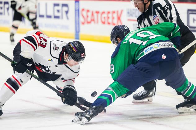 Adirondack Thunder forward Grant Loven (left) faces off with the Maine Mariners
