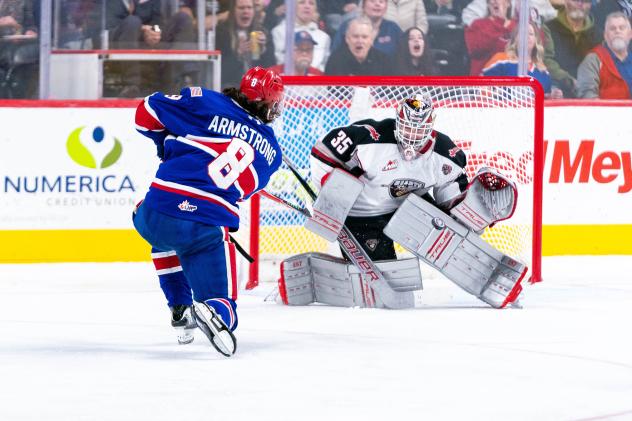 Spokane Chiefs' Coco Armstrong versus Vancouver Giants' Burke Hood