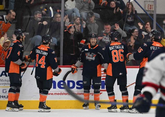 Flint Firebirds celebrate against the Saginaw Spirit