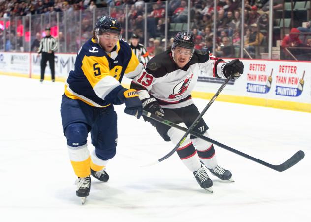 Adirondack Thunder forward Tyson Fawcett (right) vs. the Norfolk Admirals