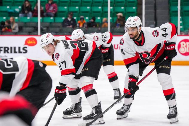 Belleville Senators centre Keean Washkurak (left) and defenceman Djibril Touré