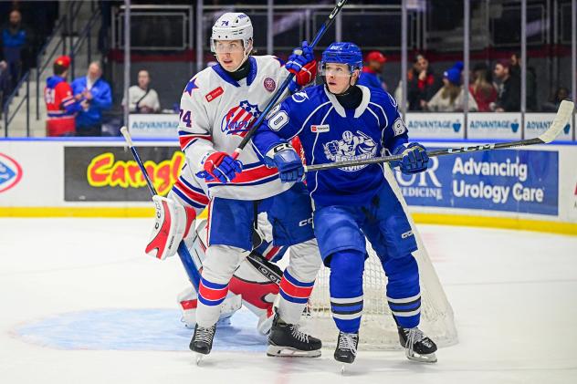 Syracuse Crunch left wing Nick Abruzzese (right) vs. the Rochester Americans