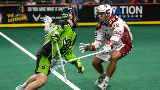 Oshawa Firewolves defender Nick Chaykowsky (right) vs. the Saskatoon Blades
