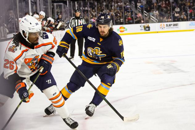 Atlanta Gladiators forward Carson Denomie (right)