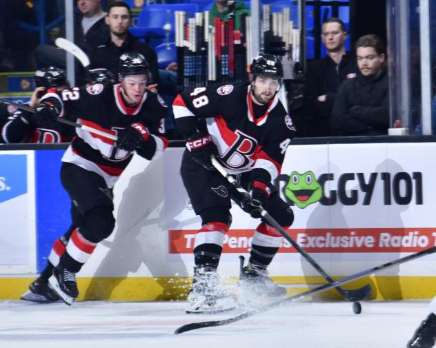 Belleville Senators right wing Oskar Pettersson (left) and defenceman Dennis Gilbert