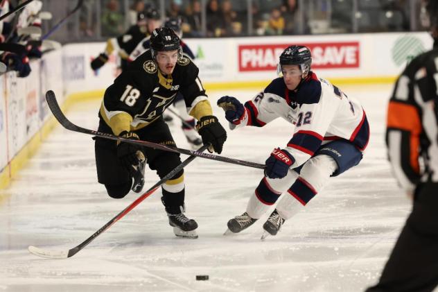 Kingston Frontenacs' Jack Dever versus Saginaw Spirit's Blake Barnes