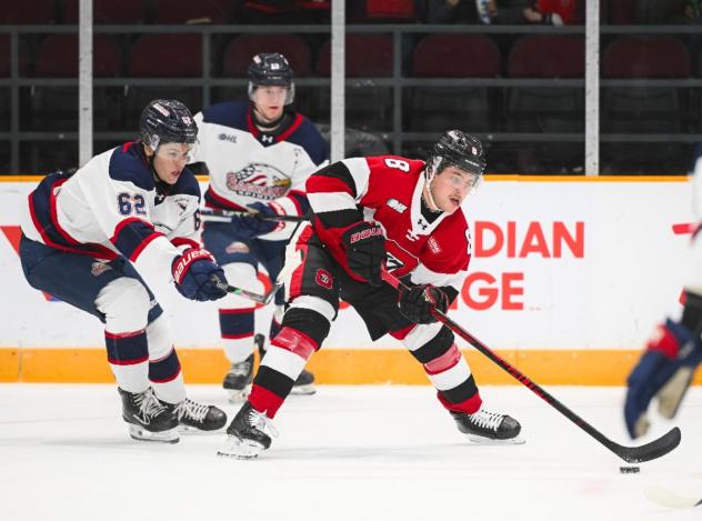 Saginaw Spirit right wing Brody Pepoy (left) vs. the Ottawa 67's