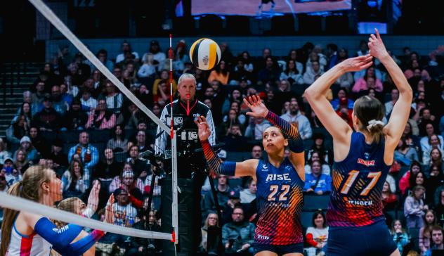 Grand Rapids Rise setter Camryn Turner (left) and middle blocker Alyssa Jensen