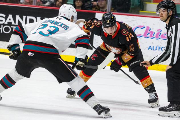 Kelowna Rockets' Hayden Paupanekis versus Prince George Cougars' Dmitri Yakutsenak