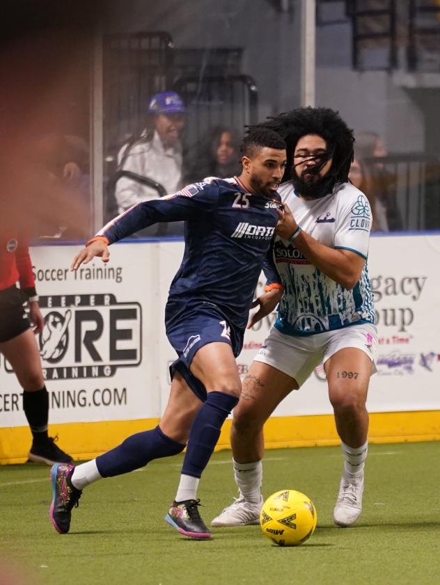 Tacoma Stars' Michael Ramos and St. Louis Ambush's Robert Williamson in action