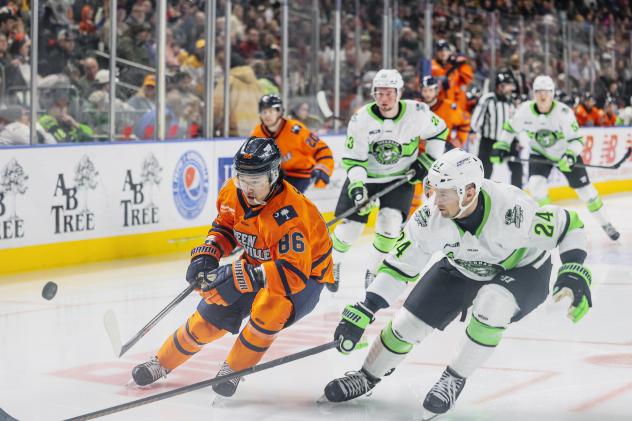 Greenville Swamp Rabbits forward Kenta Isogai (left) races for the puck vs. the Savannah Ghost Pirates