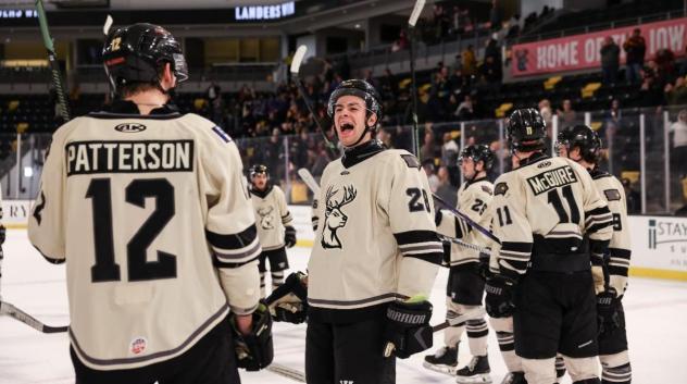 Iowa Heartlanders exchange congratulations