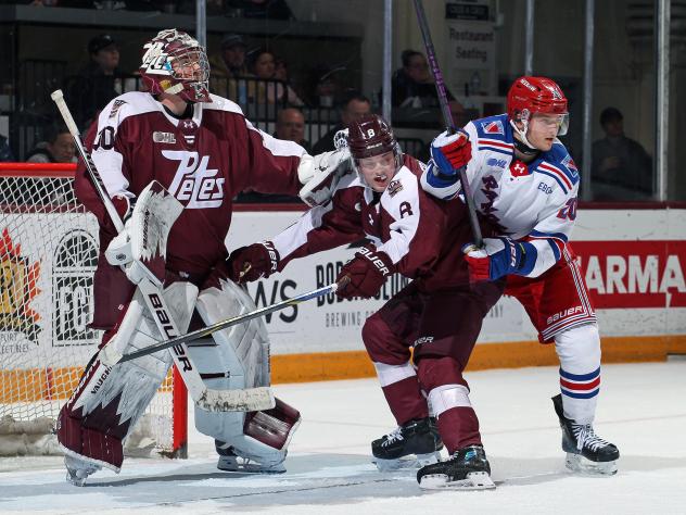 Peterborough Petes goaltender Easton Rye and defenceman Garrett Frazer vs. the Kitchener Rangers