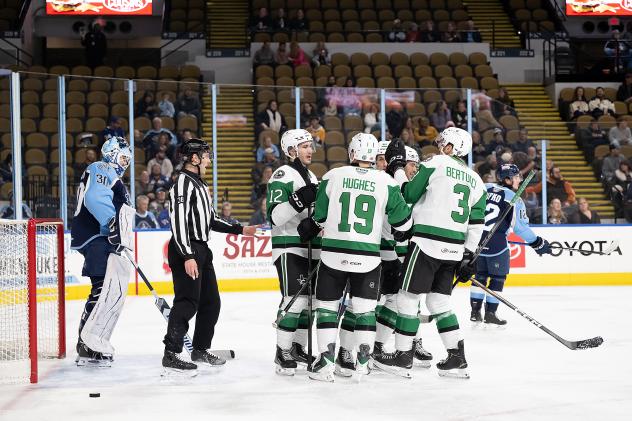 Texas Stars gather after a goal against the Milwaukee Admirals