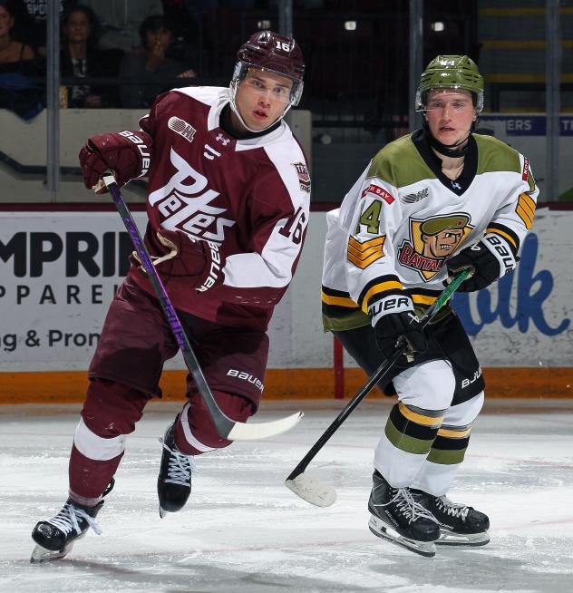 Peterborough Petes left wing Adam Novotný (left) vs. the North Bay Battalion