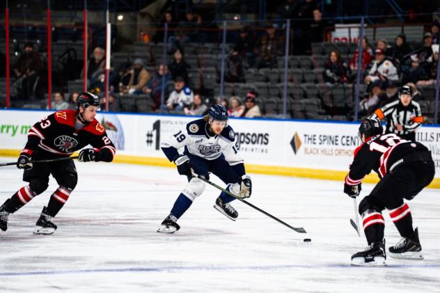 Worcester Railers forward Riley Piercey handles the puck against the Rapid City Rush