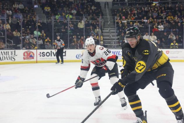 Belleville Senators defenseman Carter Yakemchuk (left) vs. the Providence Bruins