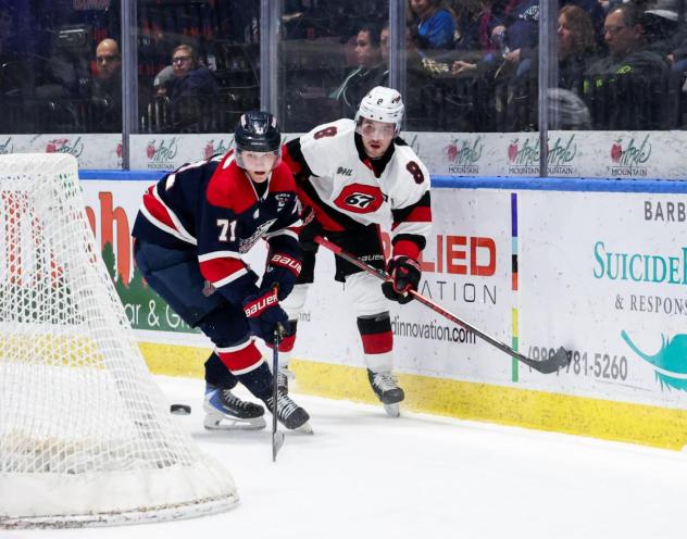 Saginaw Spirit left wing Dimian Zhilkin (left) vs. the Ottawa 67's