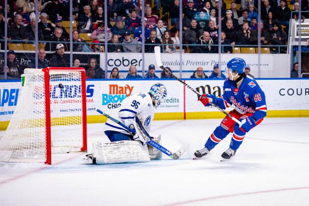 Kitchener Rangers centre Luca Romano scores against the Brampton Steelheads