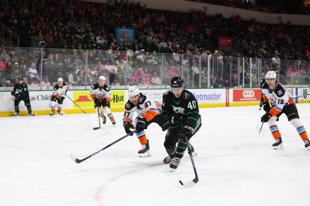 San Diego Gulls' Roland McKeown and Nikita Nesterenko and Texas Stars' Antonio Stranges on game night