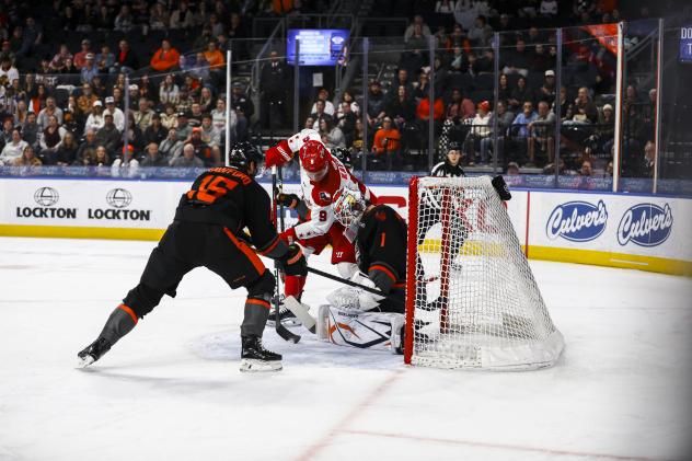 Allen Americans' Danny Katic battles Kansas City Mavericks' Marcus Crawford and Jack LaFontaine