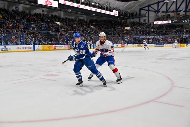 Syracuse Crunch's Jakob Pelletier and Laval Rocket's Joshua Roy on the ice