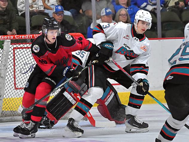 Wenatchee Wild's Drew Smith battles Kelowna Rocket's Owen Hayden