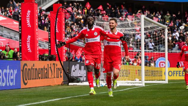 Chicago Fire FC midfielder Jonathan Bamba (left) and forward Hugo Cuypers