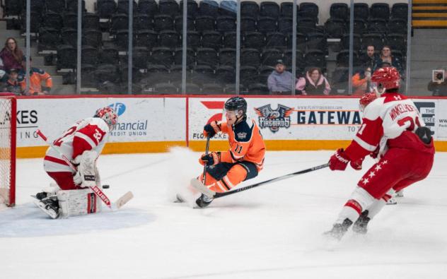 Flint Firebirds left wing Kevin He shoots against the Soo Greyhounds