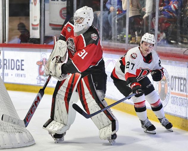 Belleville Senators centre Keean Washkurak behind the Utica Comets net