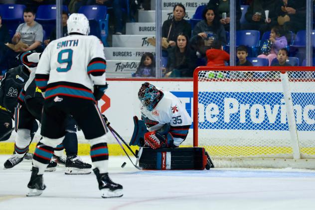 Kelowna Rockets goaltender Josh Banini makes a stop against the Vancouver Giants