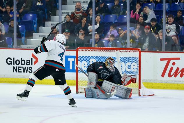 Vancouver Giants goaltender Burke Hood stops a shot against the Kelowna Rockets