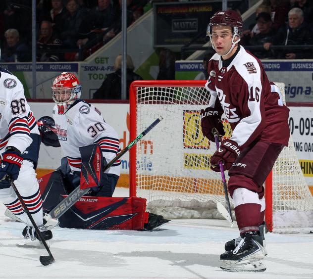 Peterborough Petes left wing Adam Novotný (right) vs. the Oshawa Generals