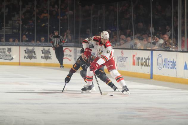 Grand Rapids Griffins forward Eduards Tralmaks handles the puck
