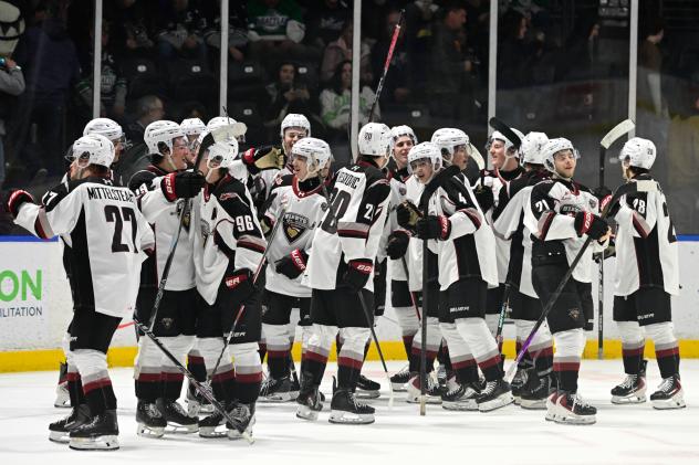 Vancouver Giants exchange congratulations after the win