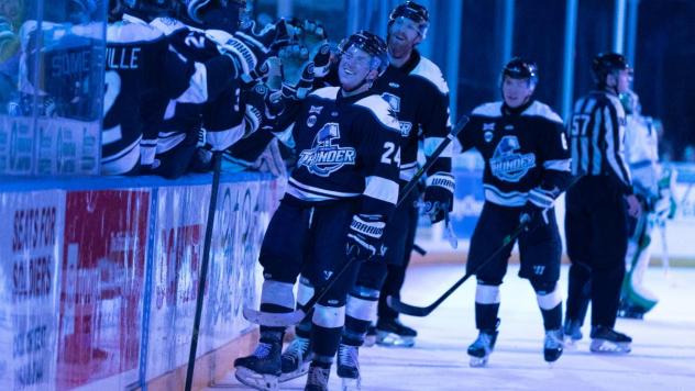 Wichita Thunder exchange congratulations along the bench